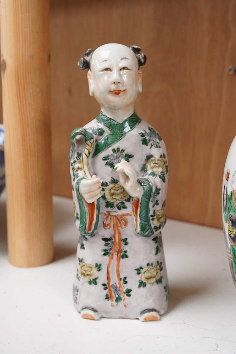 A Chinese 18th century figurine and a 20th century famille verte vase, largest 18cm high